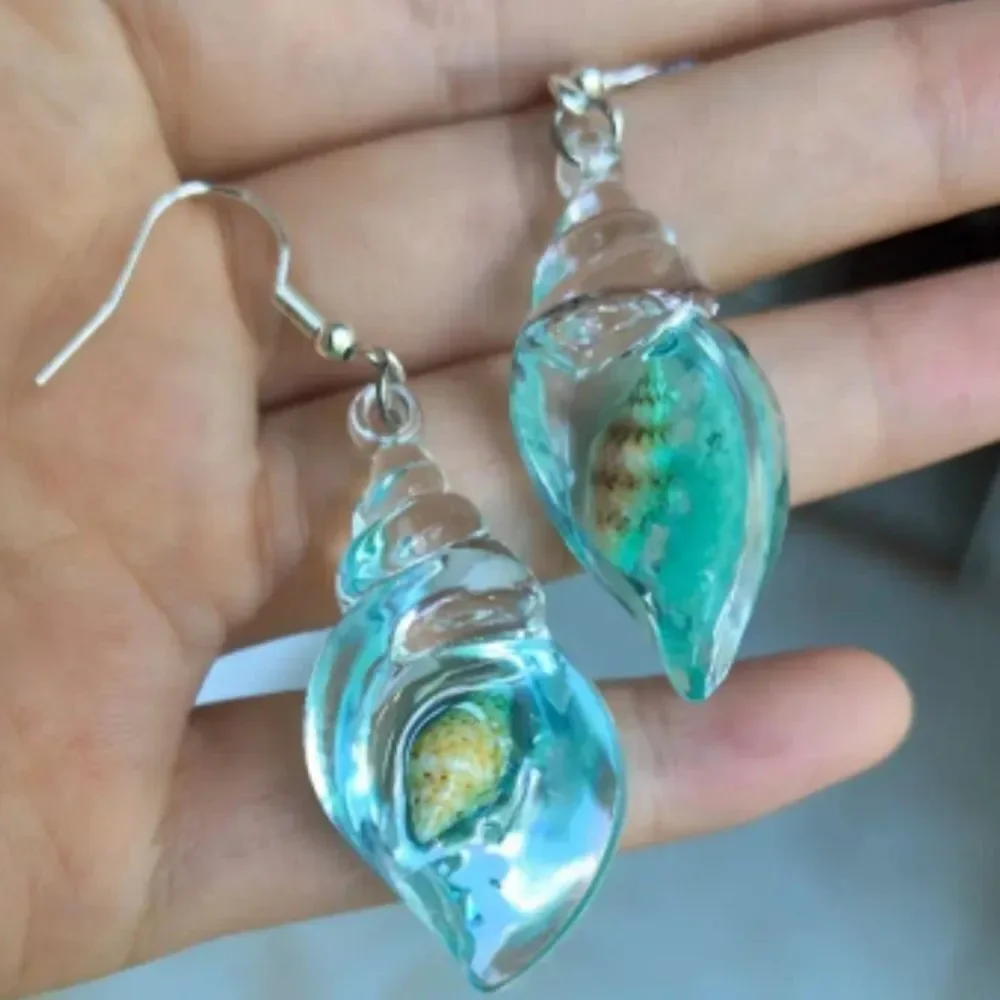 Hand crafted glowing seashell dangle earrings